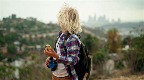 A Boy Holding a Compass and a Binocular · Free Stock Video