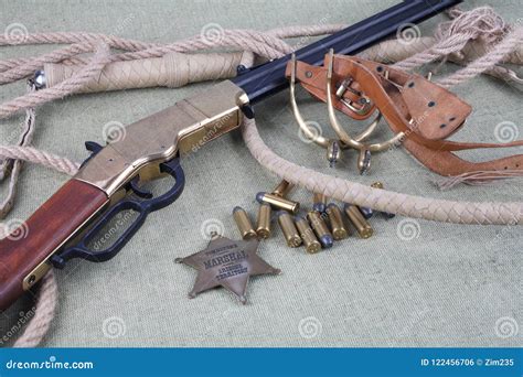 Wild West Rifle, Ammunition and Sheriff Badge Editorial Photo - Image of canvas, danger: 122456706