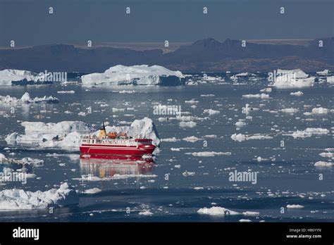 Ferry moving between icebergs, Ilulissat, Greenland Stock Photo - Alamy