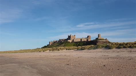 Bamburgh beach castle in distance - YouTube