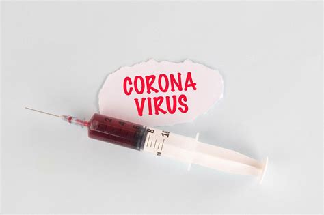 Syringe with Corona Virus text - Creative Commons Bilder