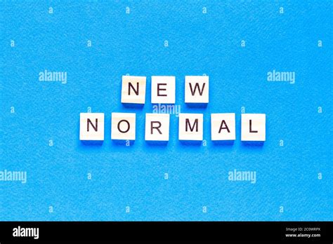 NEW NORMAL word on wooden alphabet cube. New normal concept. flat layout. top view Stock Photo ...