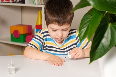 A 4-year-old Boy Applies Nail Polish To Weading Nail Biting. Stock Image - Image of anxiety ...