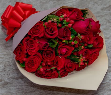 Astonishing Red Roses and Berry Flowers Bouquet - Pablo Gift Shop