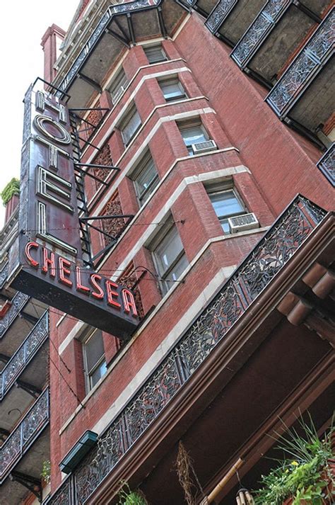 the chelsea hotel sign is hanging from the building's balconyes and ...