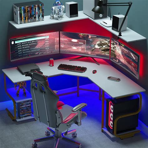 a computer desk with two monitors and a keyboard