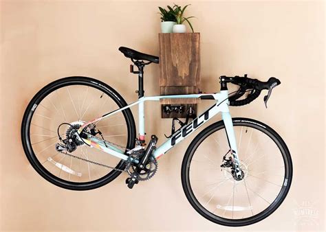 DIY Wall Mounted Bike Rack - DIY Huntress | Bike rack wall, Diy bike ...