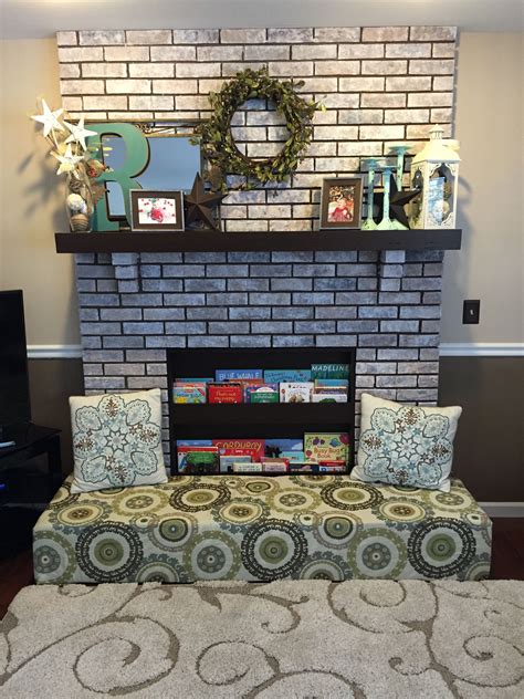 Baby proofed fireplace created with foam bench over the hearth and bookcase insert | Baby proof ...