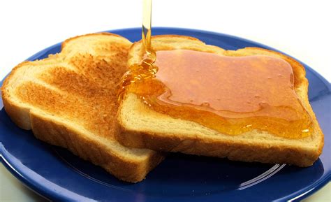 Sweet Toast Delight: HD Wallpaper of Honey-Drizzled Bread