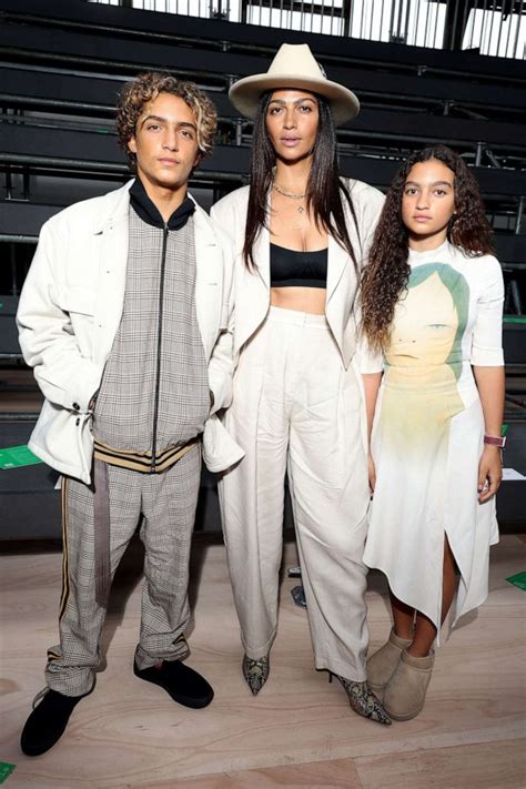 Camila Alves McConaughey color coordinates with kids Levi and Vida during Paris fashion week ...