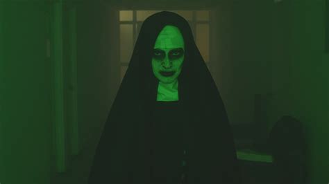 Creepy ghost nun walking looking at the camera - Free Stock Video