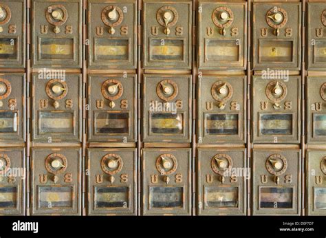 old brass US mail pigeonhole mailboxes with combination locks Stock Photo - Alamy