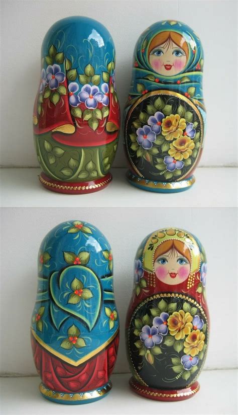 Russian babushka dolls hand painted by artist Nadezhda Tihonovich. Find more beautiful nesting ...