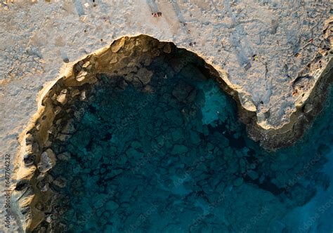 Done scenery of Cape Greko or Cape Greco sea caves Ayia Napa Cyprus. Tourist people doing ...