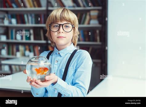 Boy with goldfish Stock Photo - Alamy