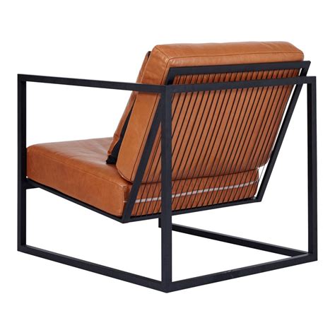 This black metal frame and Italian brown tan leather armchair is a modern and designer accent ...