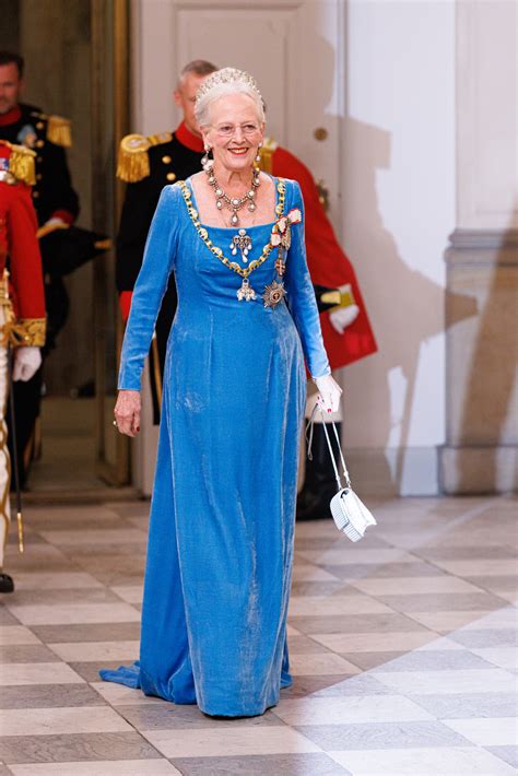 Queen Margrethe II of Denmark, 82, carries a walking stick as she is ...