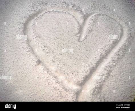 the shape of a heart made of snow Stock Photo - Alamy