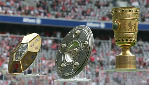 Trophy Fest: As World Cup trophy departs Abuja, Bundesliga trophy ...