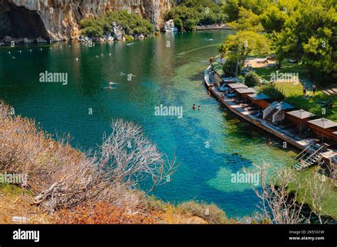 Vouliagmeni, Greece - September 1, 2022: The Lake Vouliagmeni in Vouliagmeni, Greece, in a ...