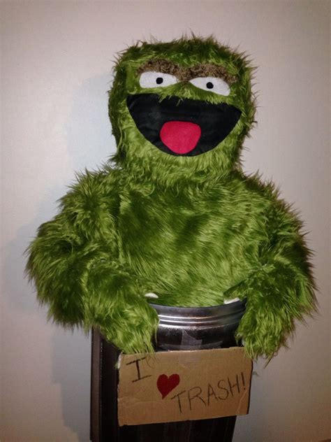 the sesame street character is holding a trash can with i love trash written on it