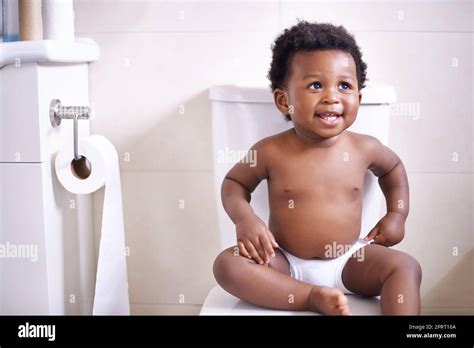 Boy sitting on toilet hi-res stock photography and images - Alamy