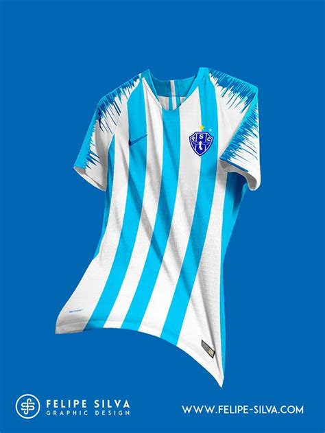 a blue and white soccer jersey with fringes on the sleeves, in front of ...