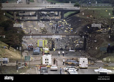 FILE - In this Aug. 16, 1987 file photo, bag-covered bodies are strewn ...