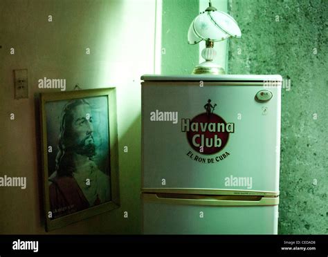 Picture of Jesus and a fridge with Havana Club logo in a private Cuban house Stock Photo - Alamy