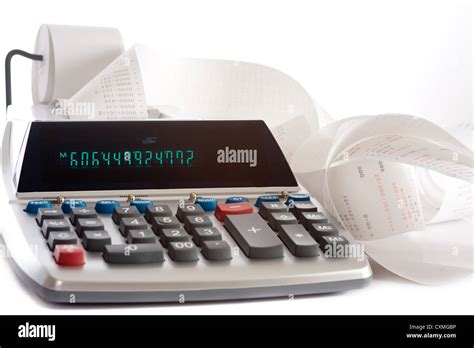 An adding machine or calculator with adding machine tape or paper Stock Photo - Alamy