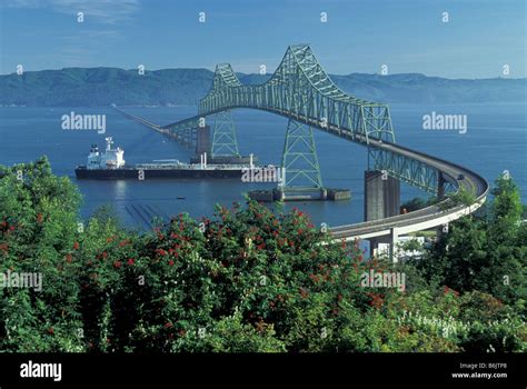 USA, Oregon Astoria, Astoria Bridge. Freighter passing under Astoria ...