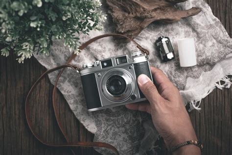 Premium Photo | Vintage camera in photographer's hand