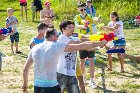 Premium Photo | Children playing water battle water game battle