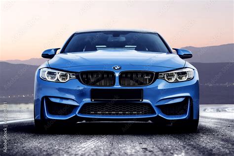 blue BMW m3 on a mountain winding road. front view. Stock Photo | Adobe Stock