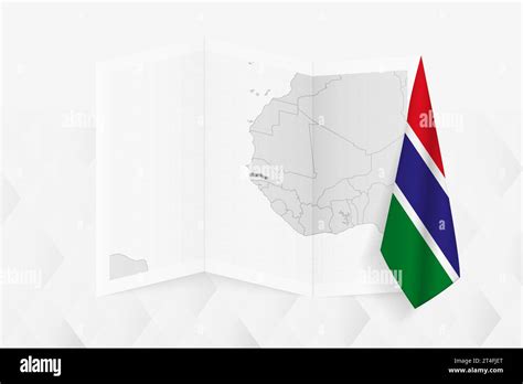 A grayscale map of Gambia with a hanging Gambian flag on one side. Vector map for many types of ...