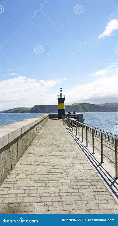 Lighthouse of the Port of Comillas, Santander Stock Image - Image of ...