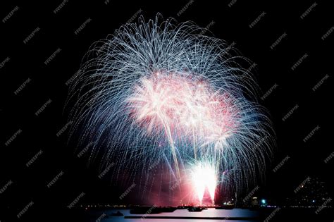 Premium Photo | Fireworks on beach at sky to night.