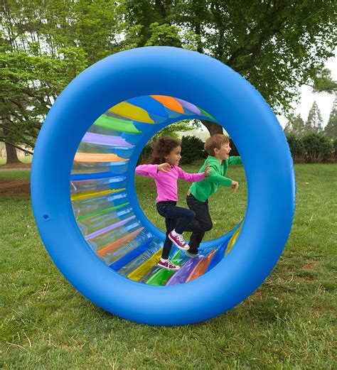 Roll With It 2.0 Giant Inflatable Rainbow Land Roller | Outdoor toys for kids, Backyard toys ...