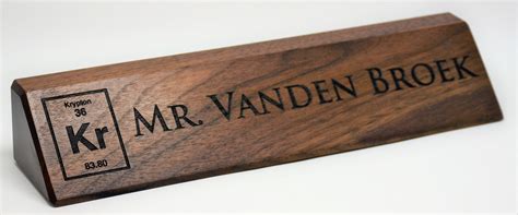 THESE 10 INCH DESK NAME PLATES ARE MADE FROM SOLID WALNUT WOOD. THEY ARE LASER ENGRAVED WITH THE ...