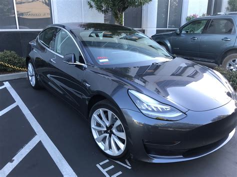 Black Tesla Car Parked in Parking Lot