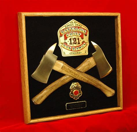 Gold shield, Brass axe heads and Gold badge... Can you tell this one was made for a retiring ...