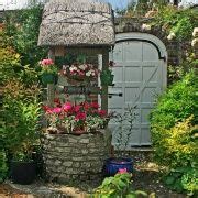 Wishing well with beautiful flowers. | Cottage garden, Planter pots outdoor, Lawn and landscape