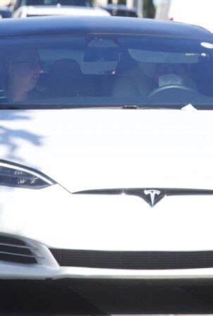 Ariana Grande - Driving Tesla in Los Angeles-01 | GotCeleb