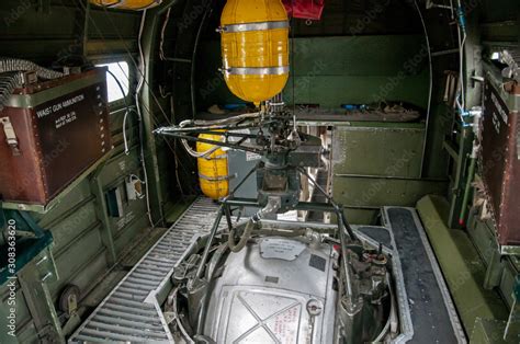 B-24 Liberator interior view of Ball Turret mount with yellow oxygen tanks and ammo cans. Stock ...