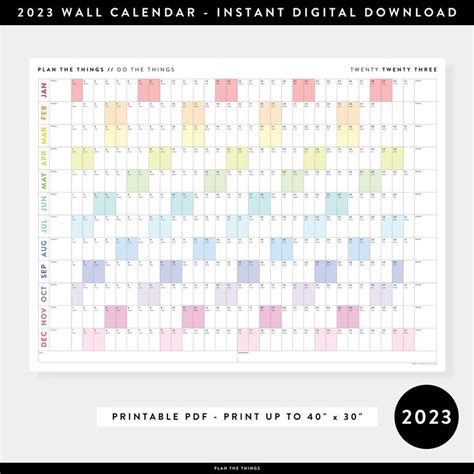 the printable wall calendar is shown in pink, yellow and blue