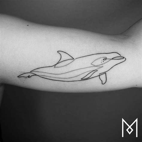 Continuous line dolphin tattoo on the left inner arm. | Dolphins tattoo ...