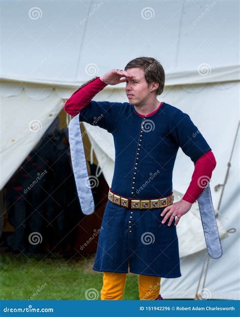 A Medieval Squire Surveys the Camp Stock Photo - Image of costume, male ...