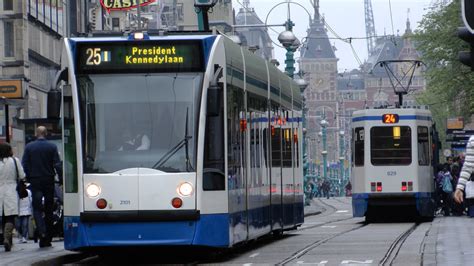 Tram on Damrak in Amsterdam, Netherlands image - Free stock photo - Public Domain photo - CC0 Images