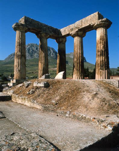 Corinth Greece the Temple of Apollo dating from the 6th century BC, the Acrocorinth is seen ...