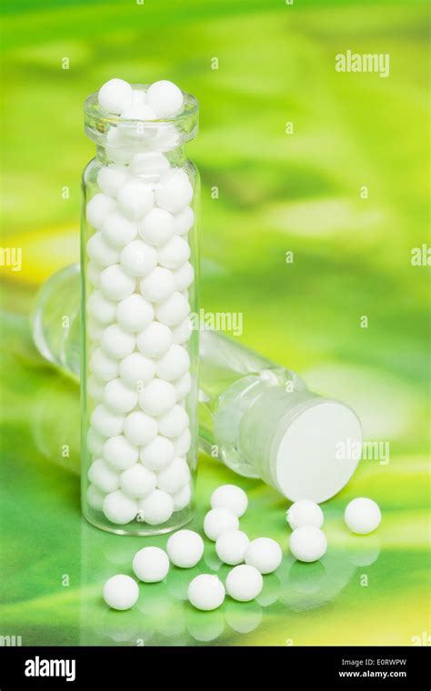 Homeopathic medicine consisting of homeopathic pills and liquid homeopathic substance Stock ...